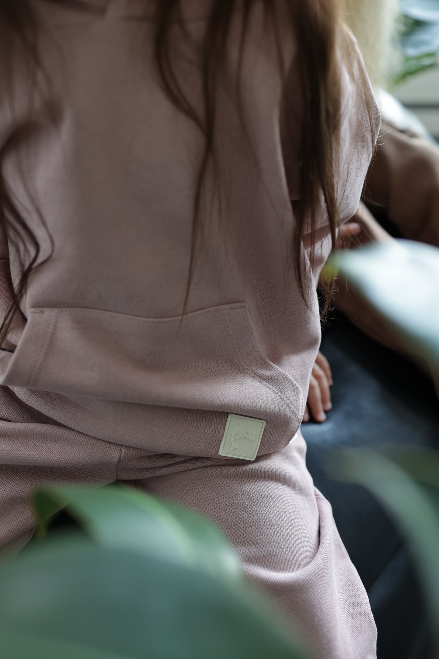 Close-up of brushed terry fabric and tapered fit – wheat kids sweatpants