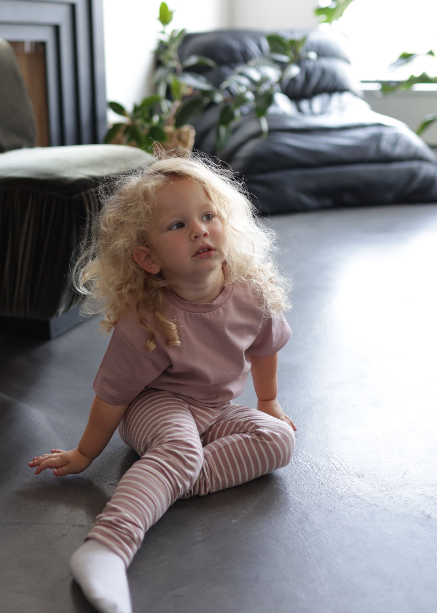 Child wearing mauve striped extra‑long leggings – side view with elastic waist