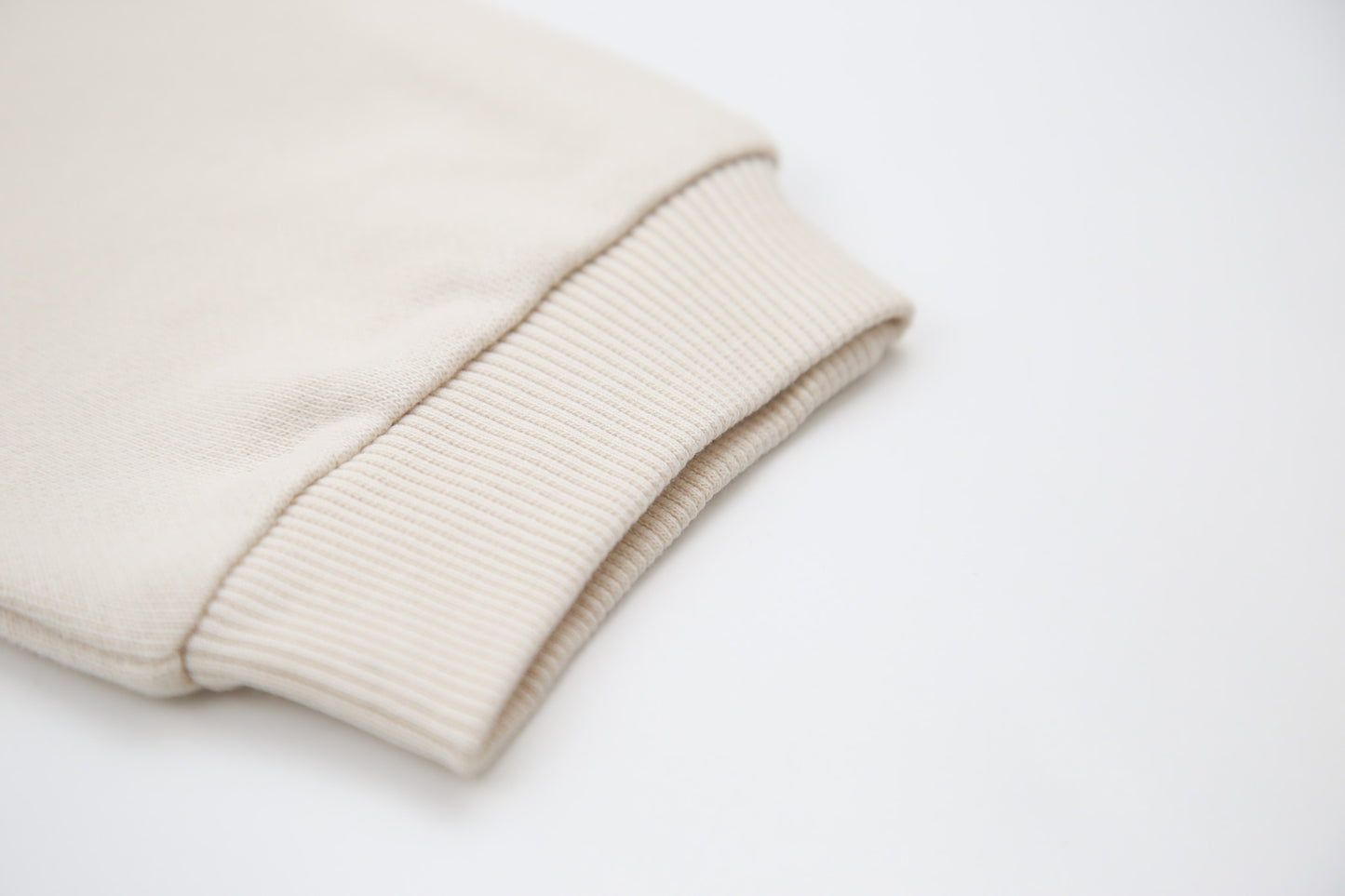 Rib cuff and elastic waistband detail on oat french terry kids sweatpants