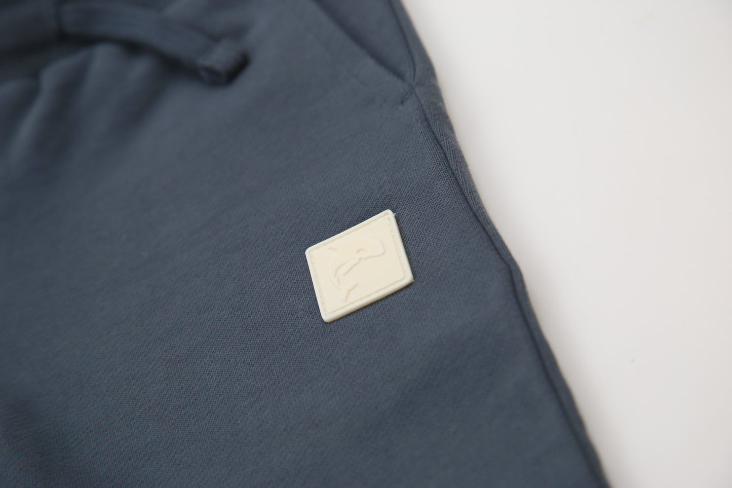 Close-up of organic french terry fabric texture – fjord blue kids sweatpants
