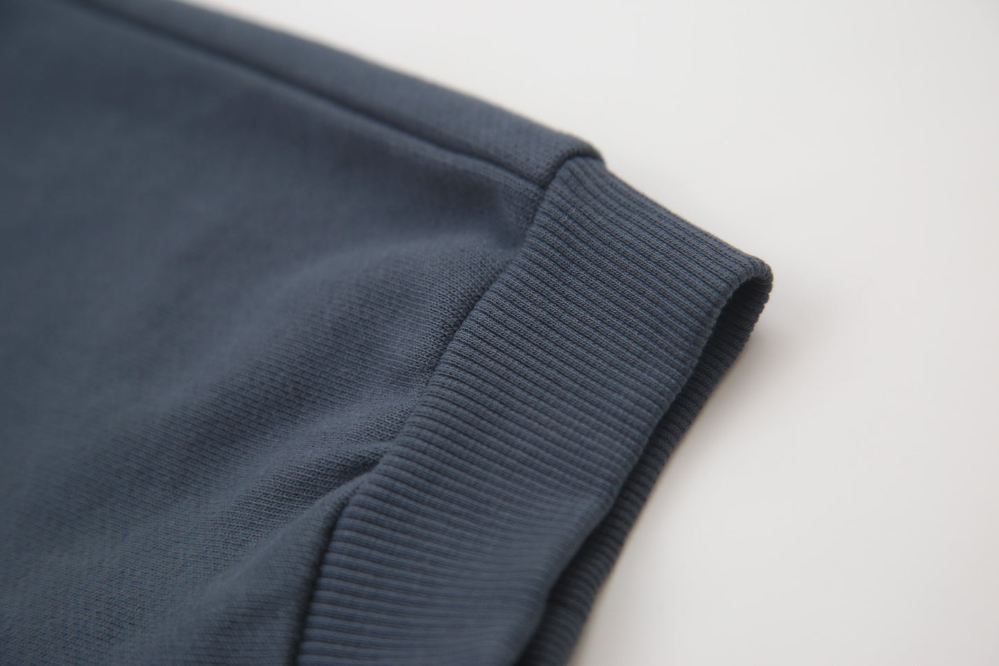 Close-up of organic french terry fabric texture – fjord blue kids sweatpants