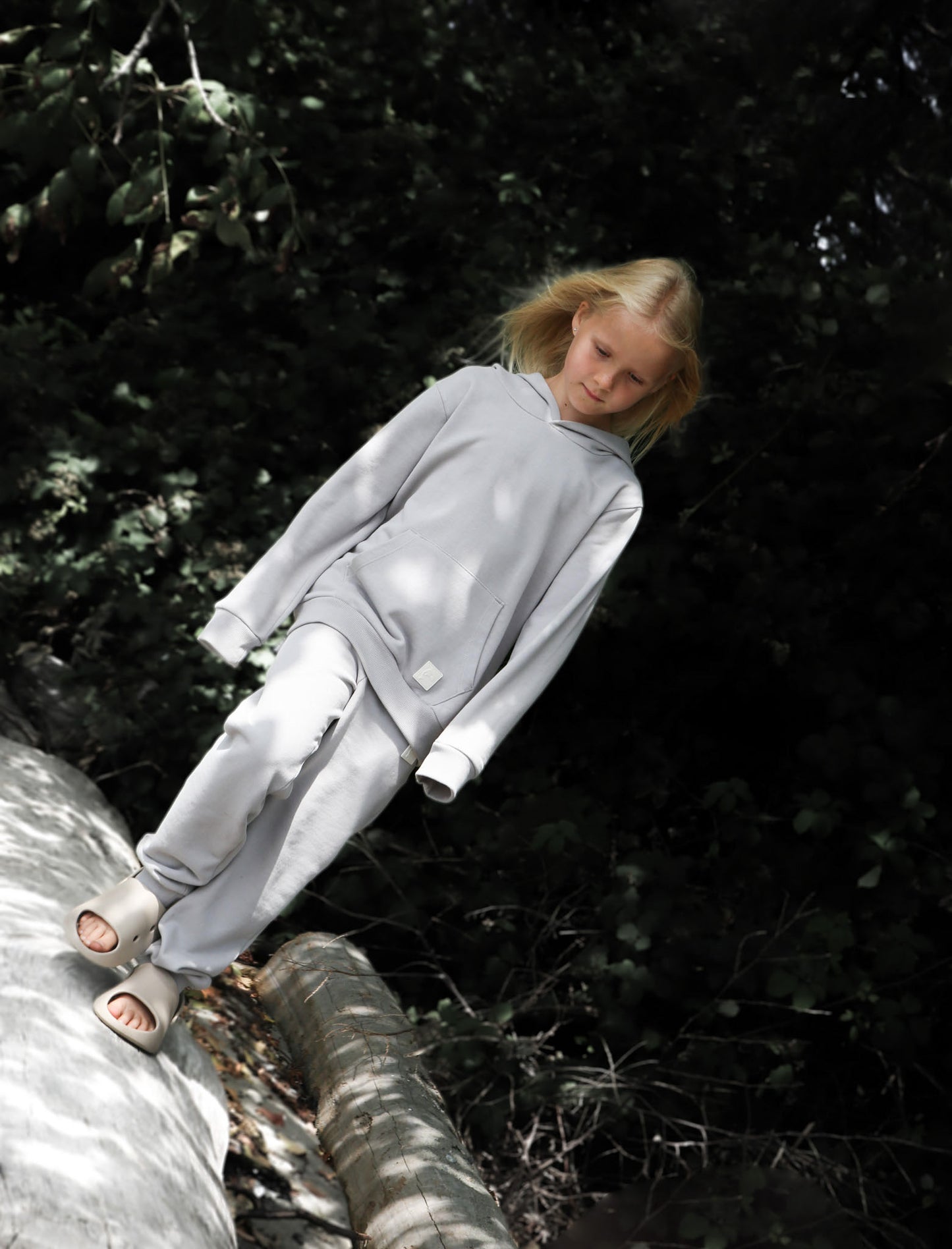 Kid playing in dove grey brushed terry sweatpants by KidORCA