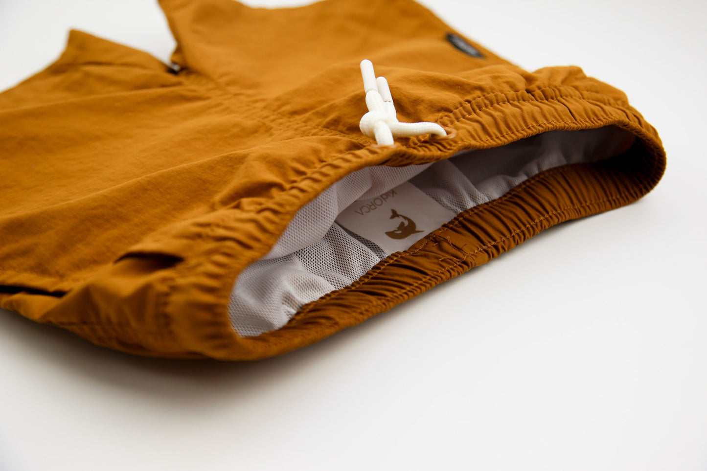 Elastic waistband detail on ginger boys swim trunks