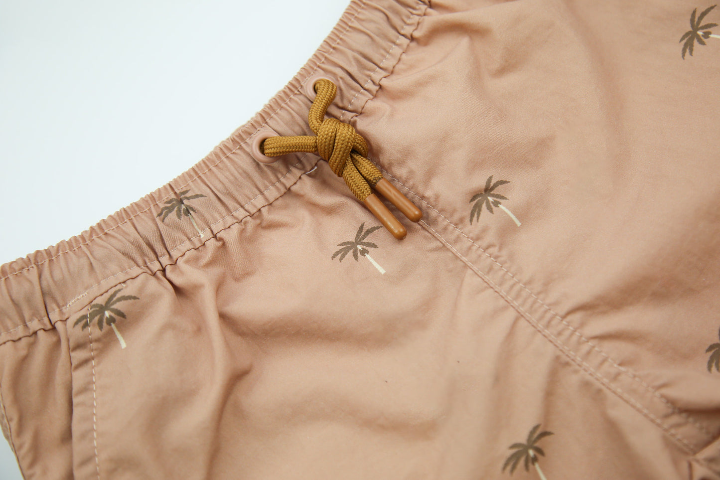 Elastic waistband detail on palm Tuscany boys swim trunks