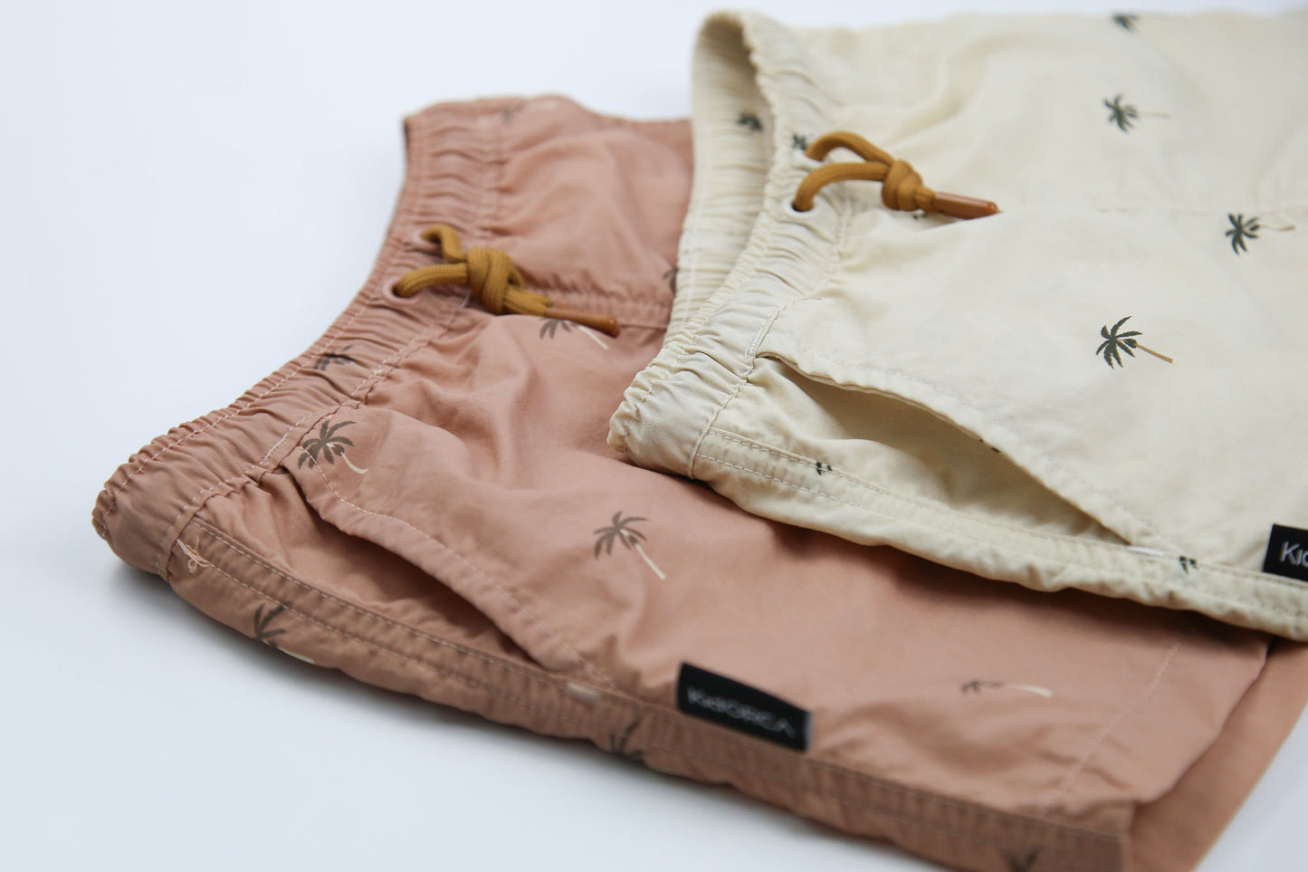 Close-up of quick-dry recycled nylon fabric – palm Tuscany swim trunks