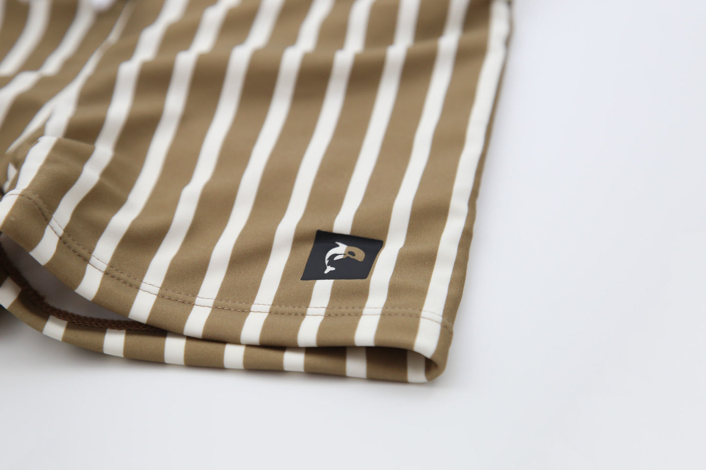 Close-up of quick-dry recycled nylon fabric – stripe khaki boardie shorts
