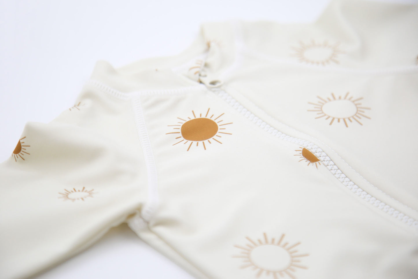 Close‑up of stretchy quick‑dry fabric – Sun Rays Shell baby jumpsuit