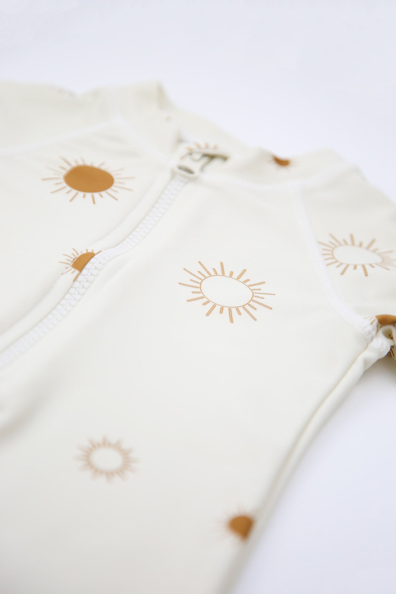 Front zipper and high collar detail – Sun Rays Shell jumpsuit