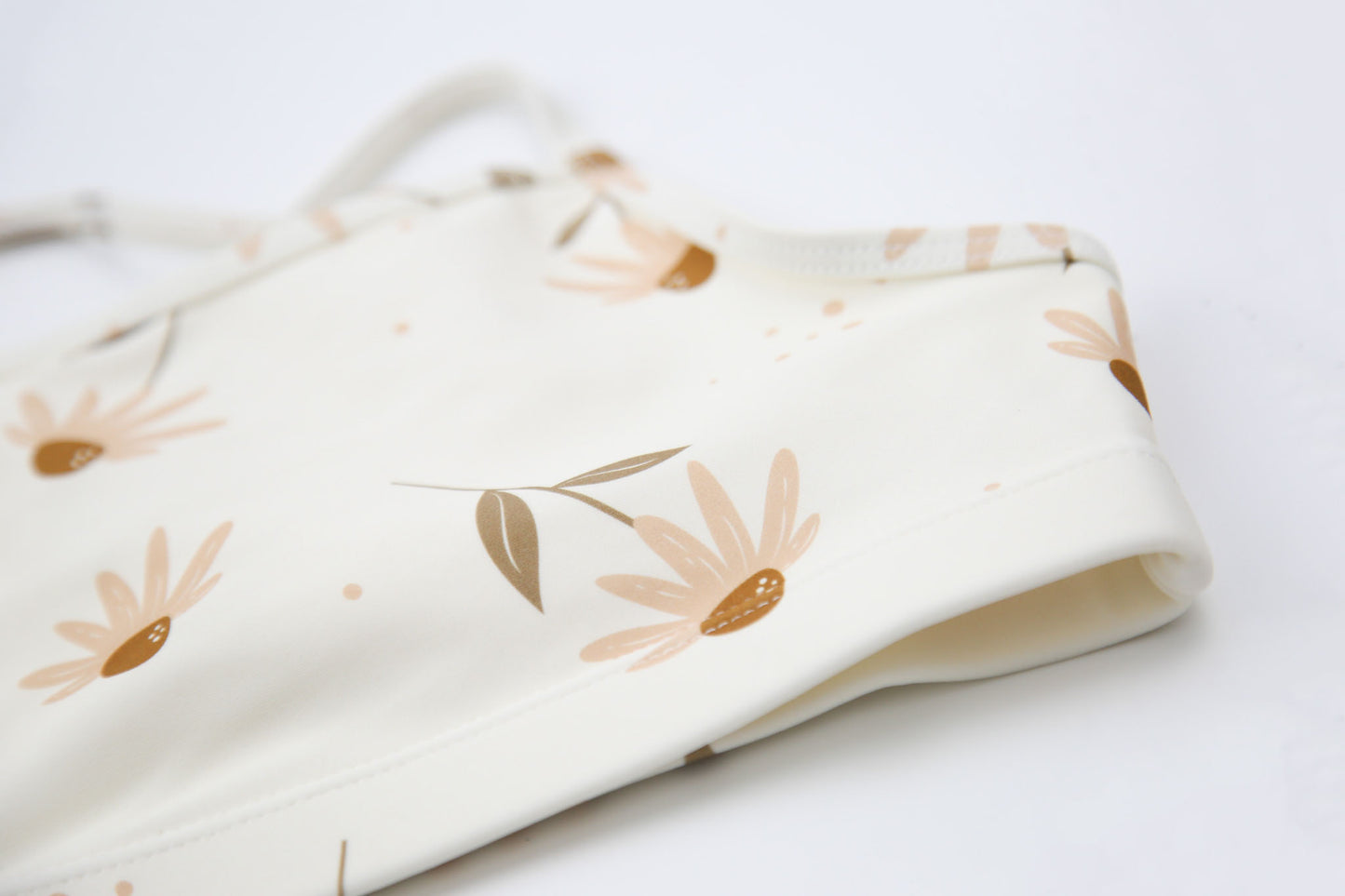 Close-up of coconut print quick-dry fabric – Viola swim top