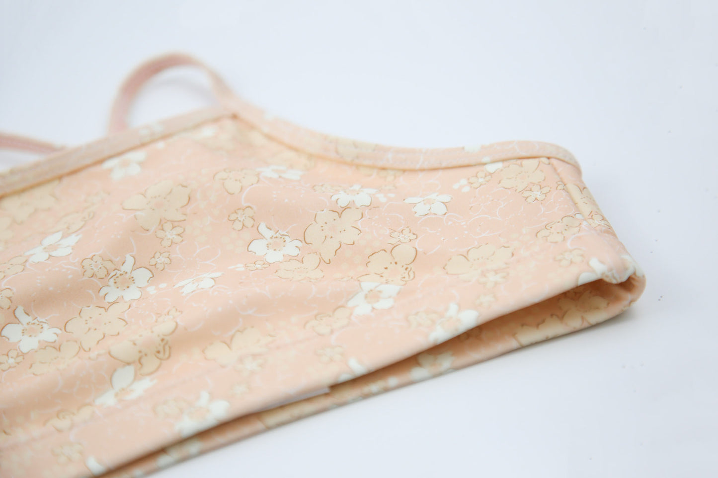 Close-up of Tuscany-print quick-dry fabric – Evangelina swim top
