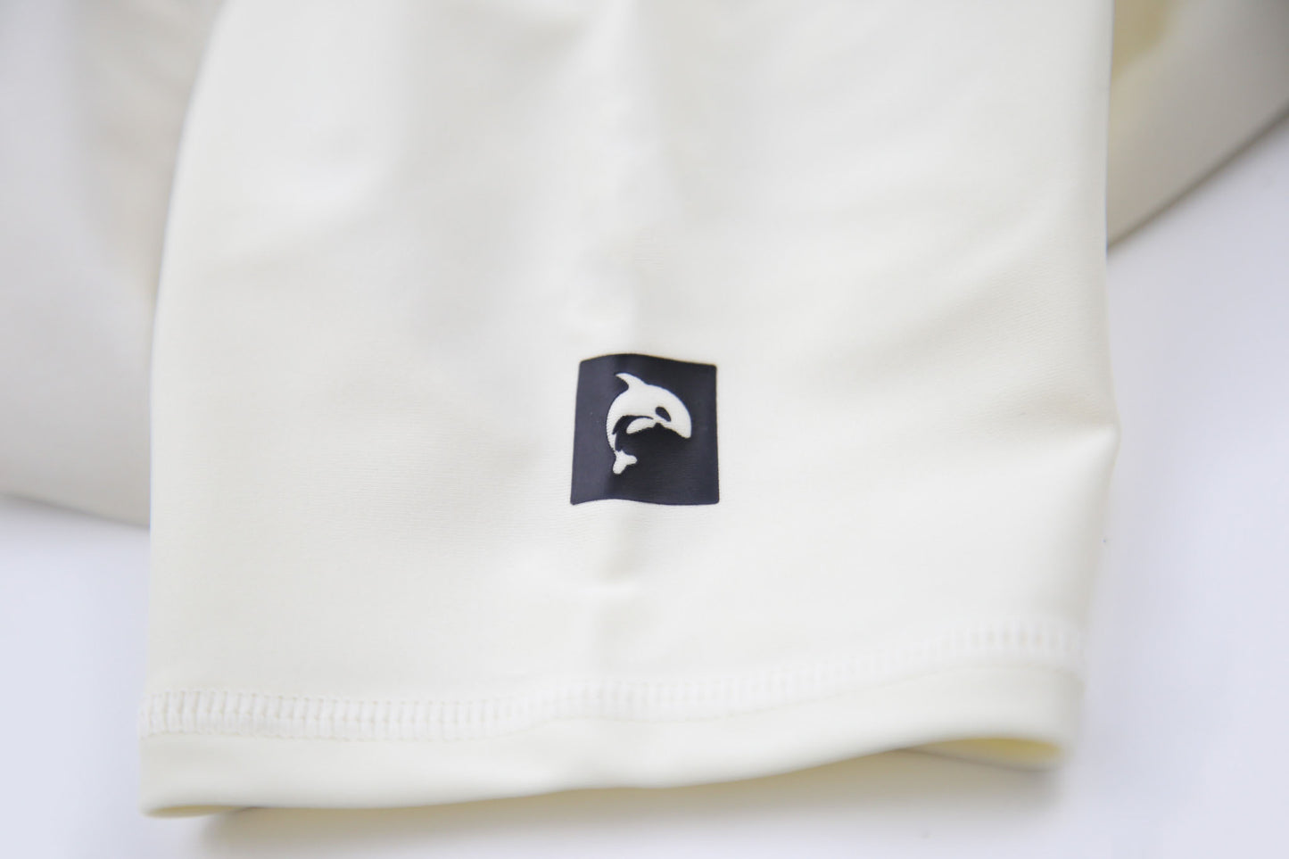 Close-up of UPF 50+ quick-dry recycled polyester – crab rashguard