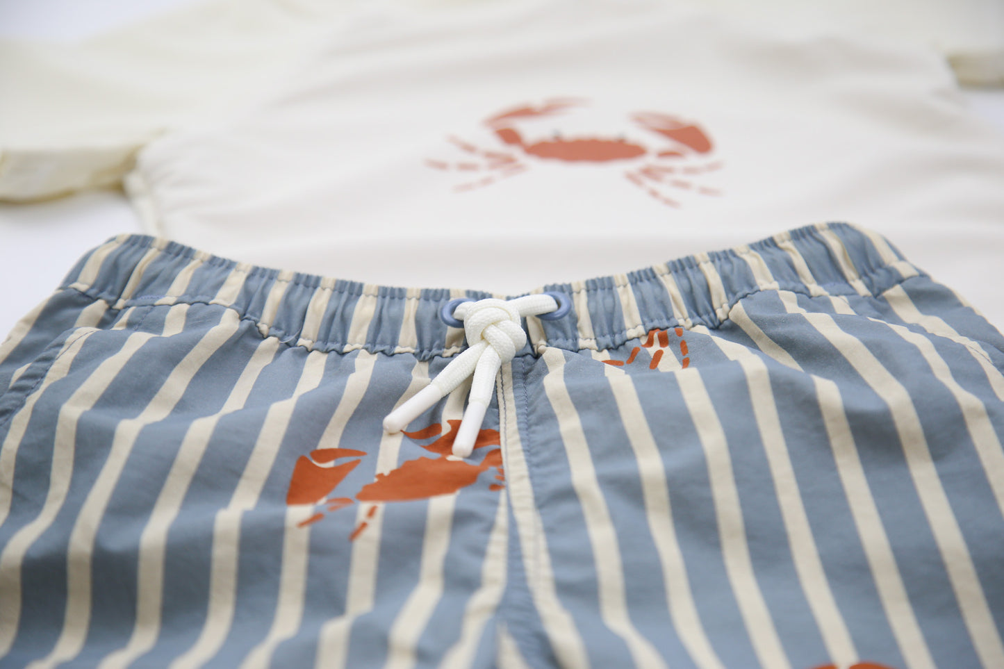 Elastic waistband detail on crab slate boys swim trunks