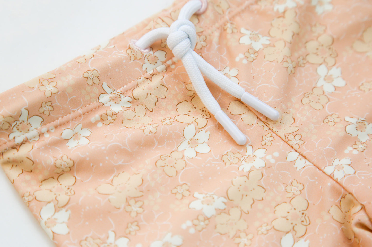 Close-up of quick-dry Tuscany print fabric – Evangelina swim boardie shorts