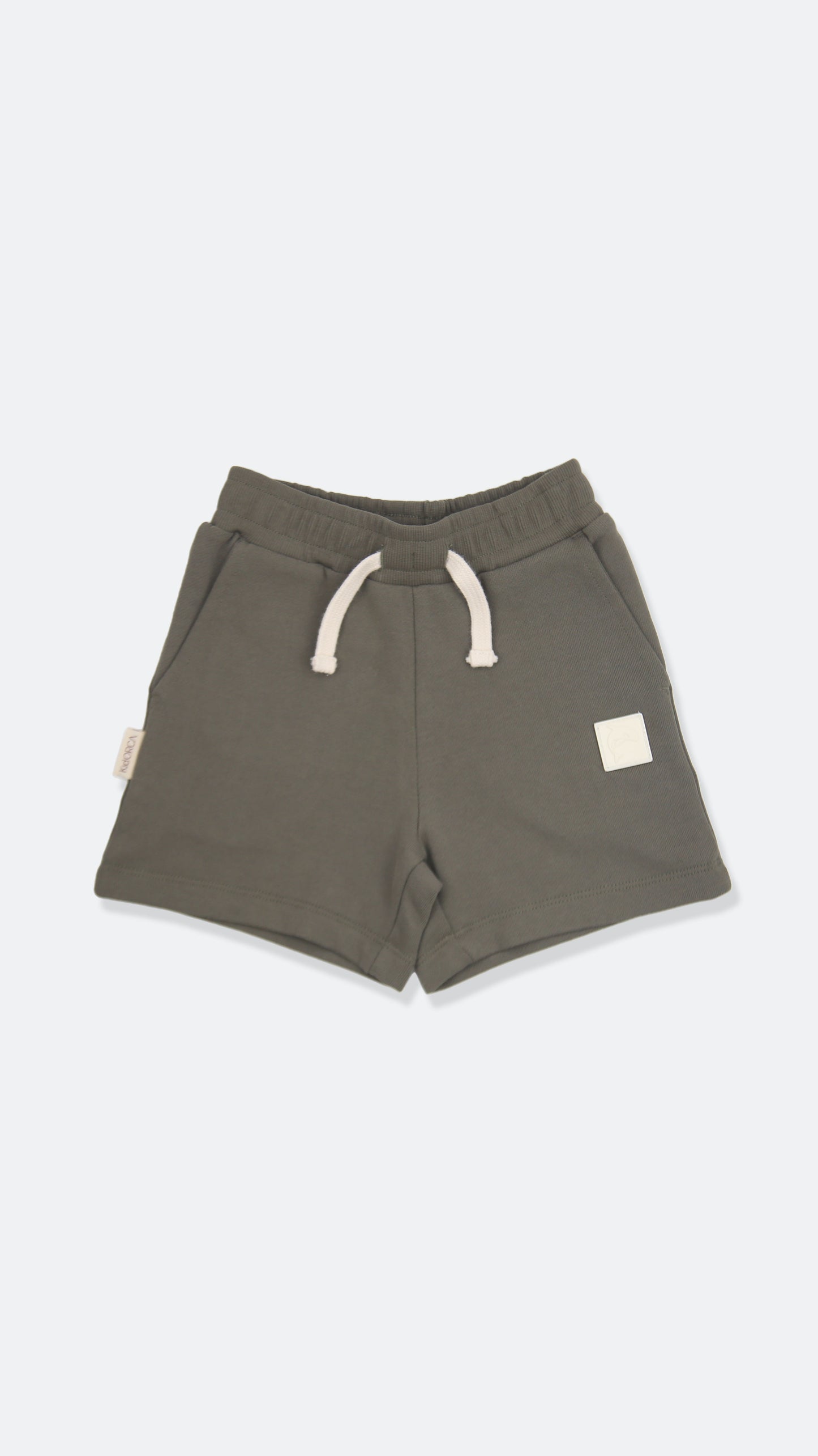 Organic french terry kids shorts in dusty olive color – front view
