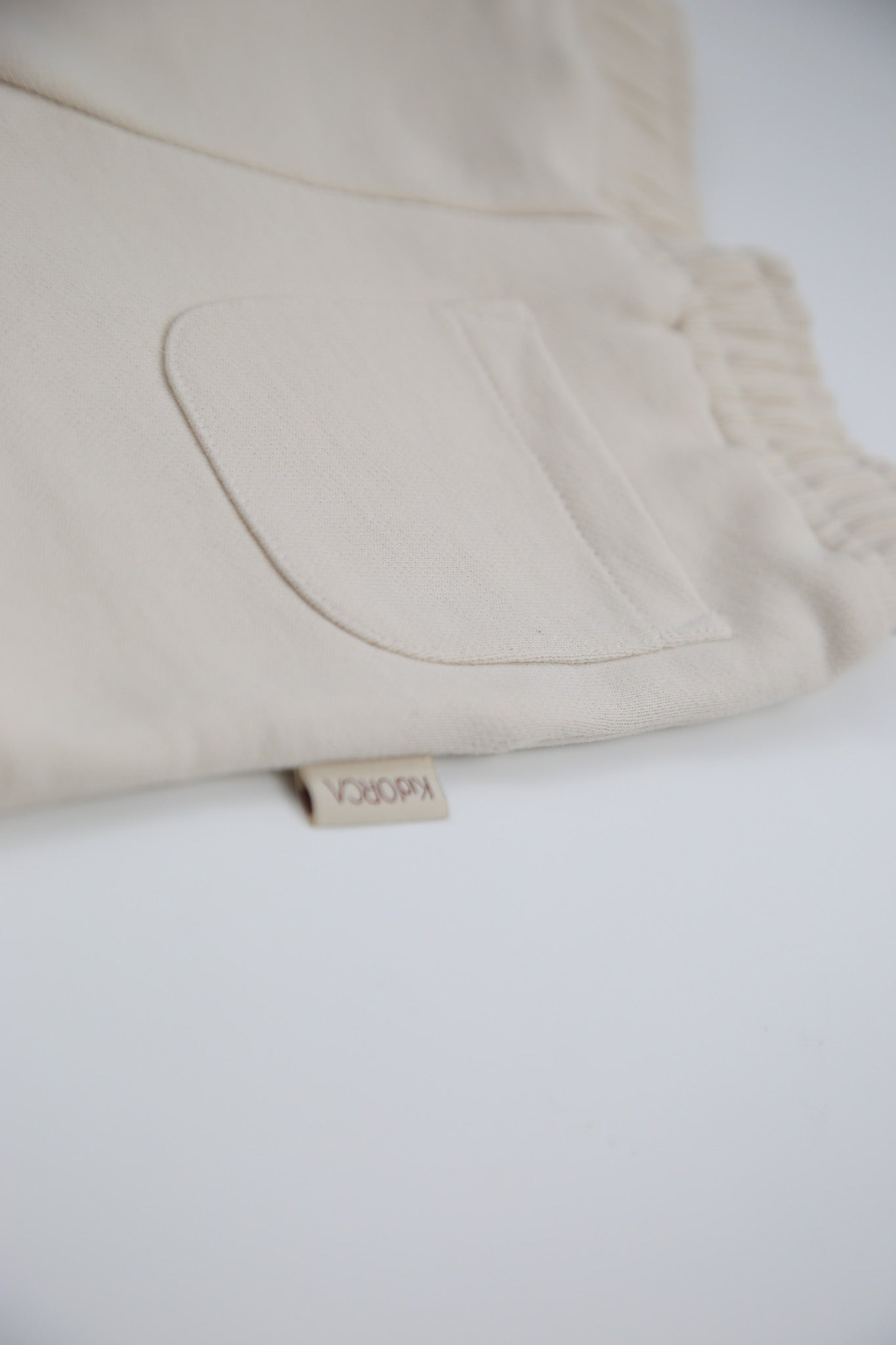 Close-up of french terry fabric and elastic waistband – oat kids shorts