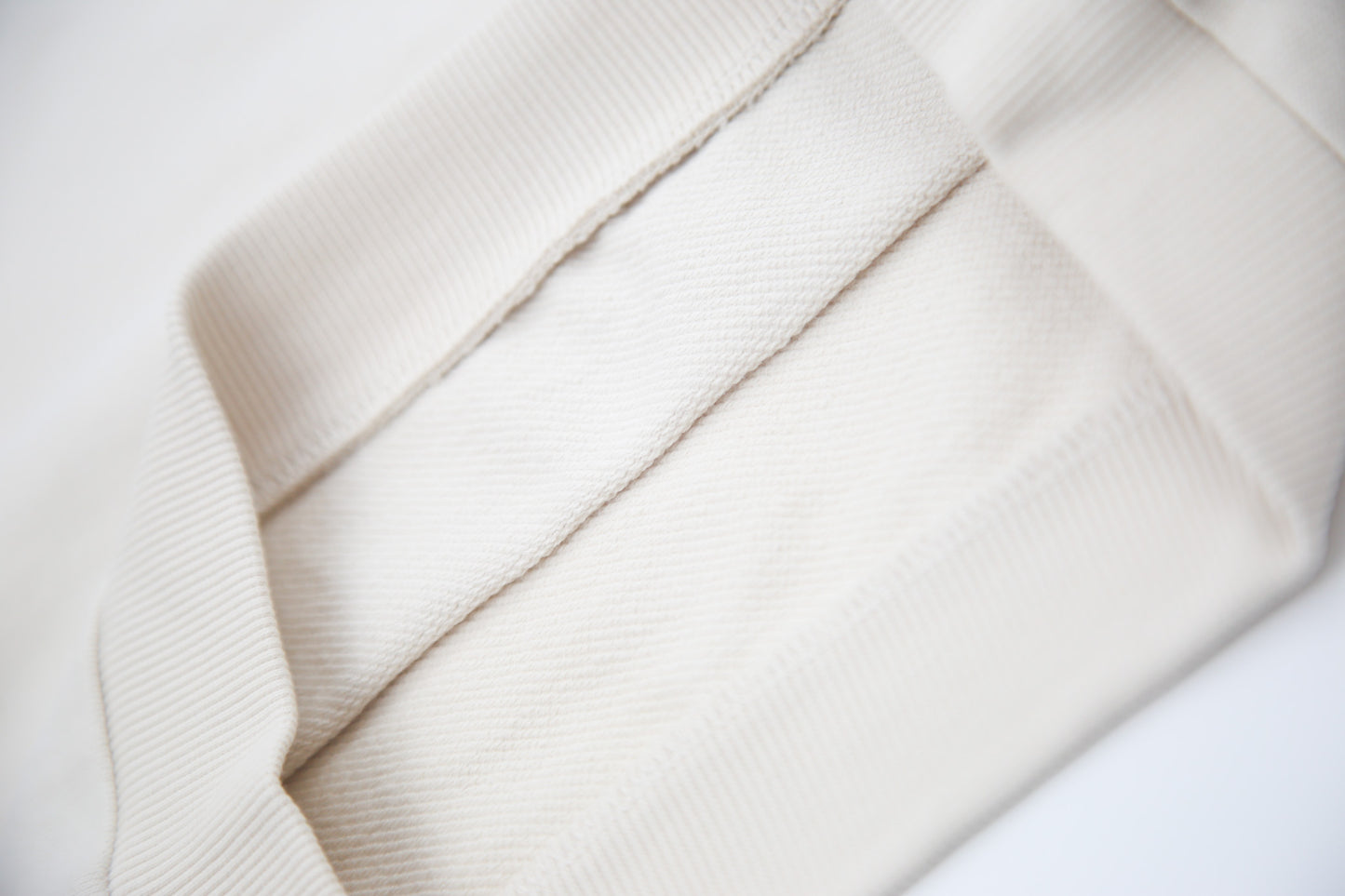 Rib cuff and hem detail on oat french terry kids sweatshirt
