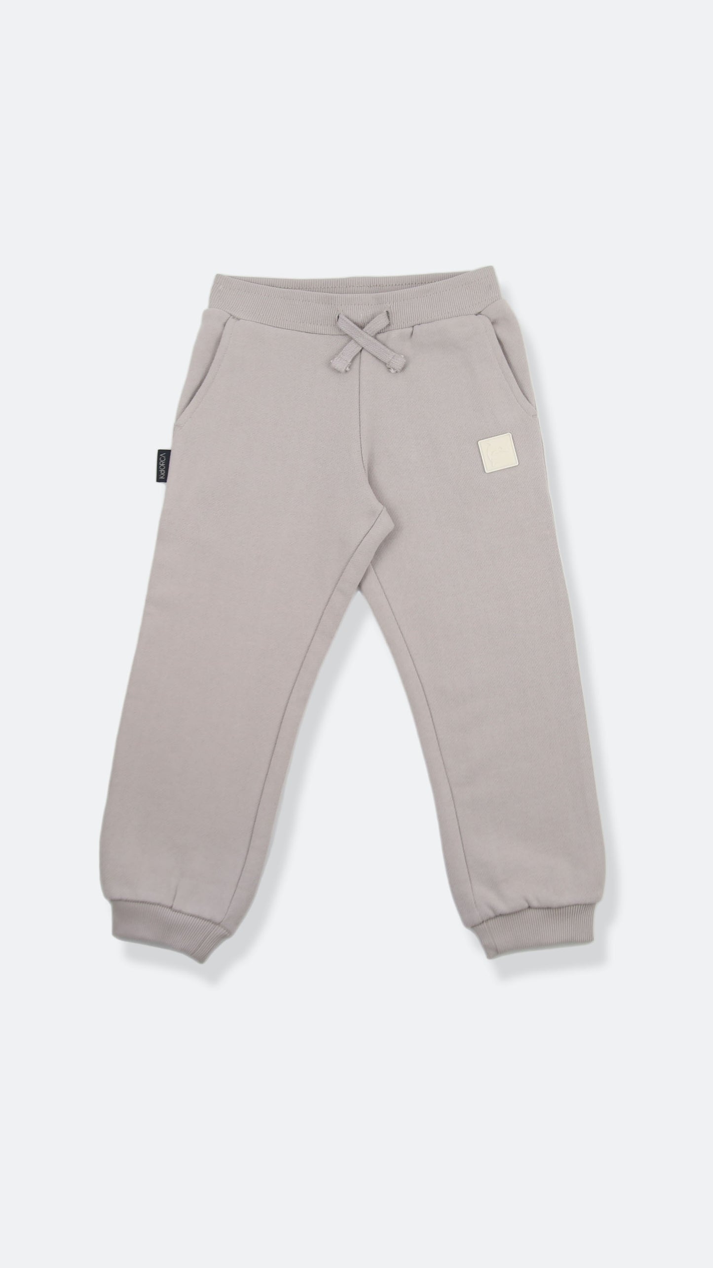 Organic brushed terry kids sweatpants in dove grey – front view