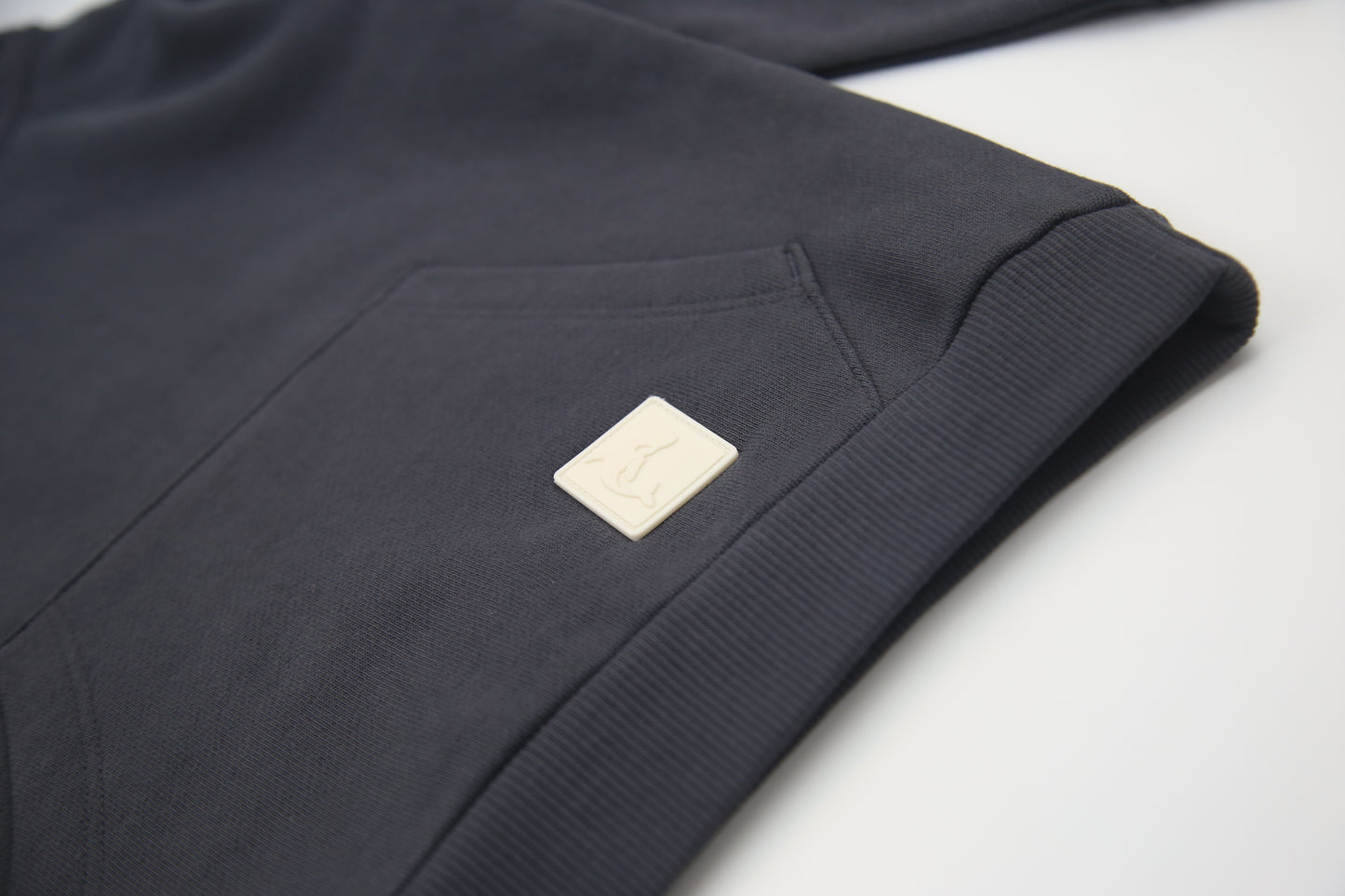 Kangaroo pocket and rib cuff detail on lava brushed terry kids hoodie