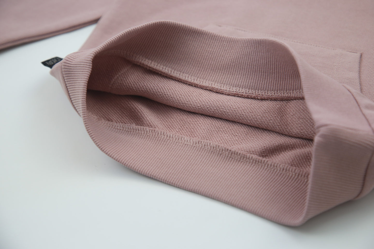 Close-up of french terry fabric and hood detail – mauve kids hoodie