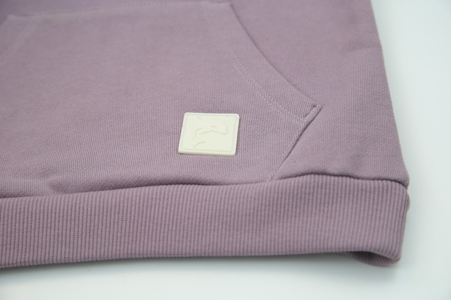 Rib cuff and hem detail on elderberry french terry kids sweatshirt
