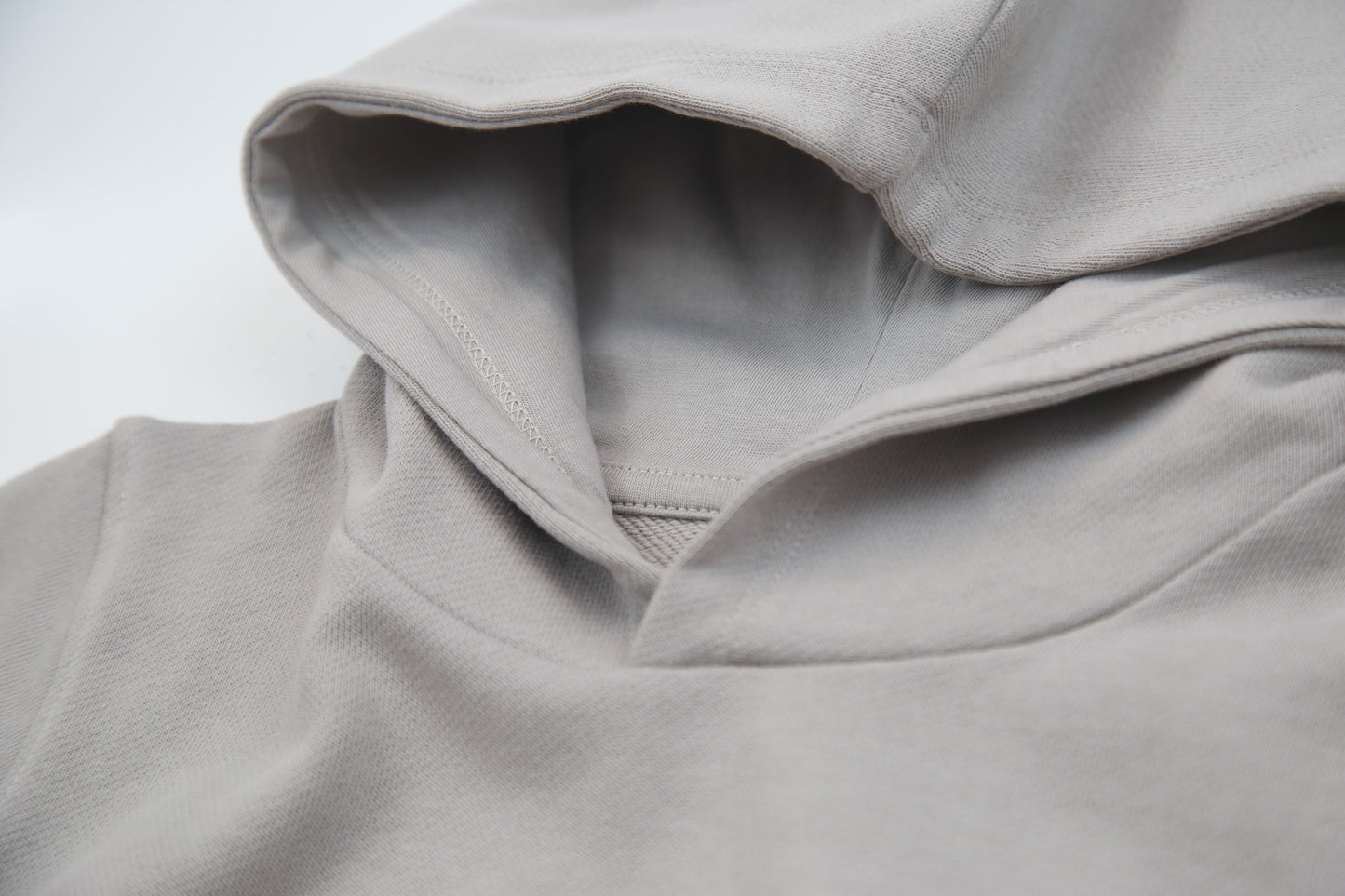 Close-up of french terry fabric and hood detail – pebble kids hoodie