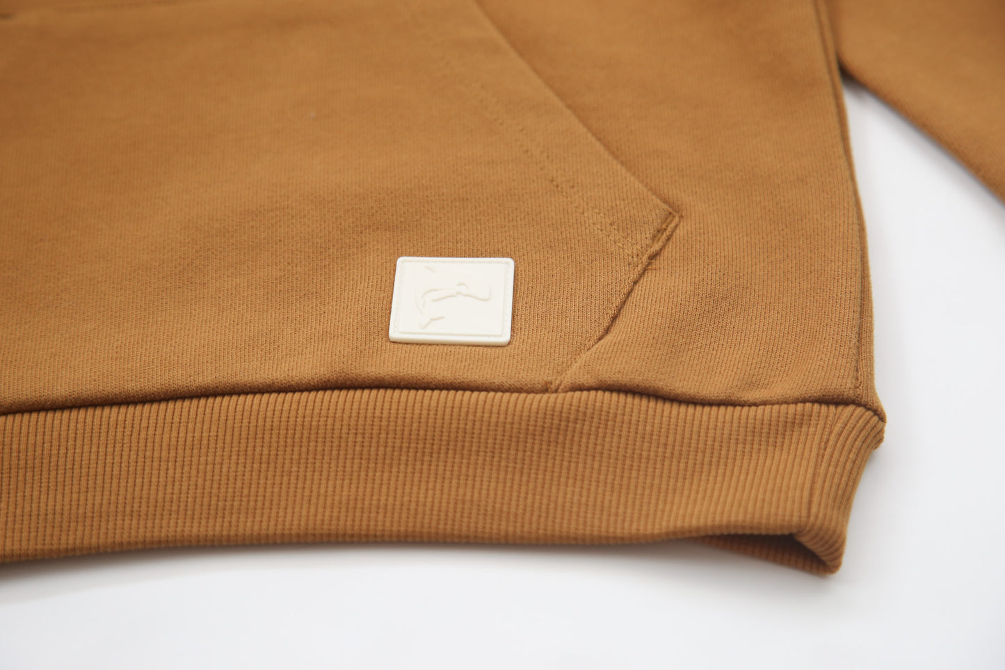 Kangaroo pocket and rib cuff detail on ginger french terry kids hoodie