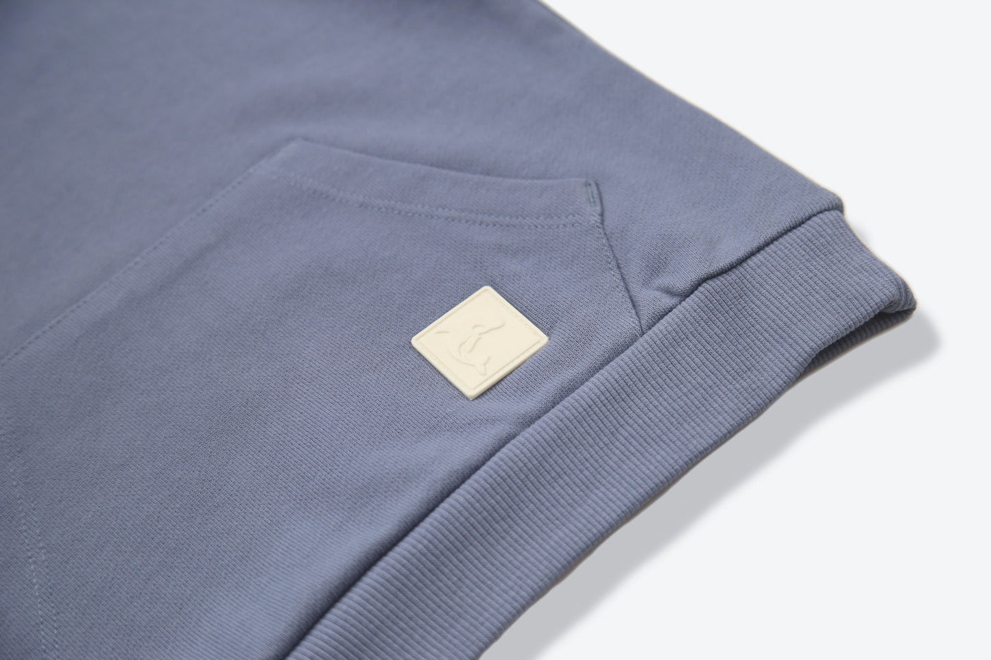Kangaroo pocket and rib cuff detail on flint french terry kids hoodie