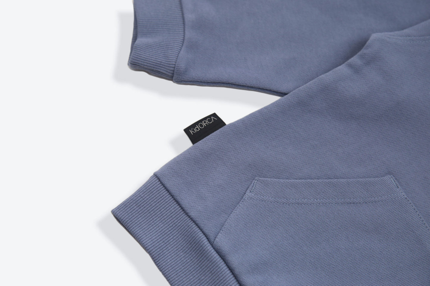Kangaroo pocket and rib cuff detail on flint french terry kids hoodie