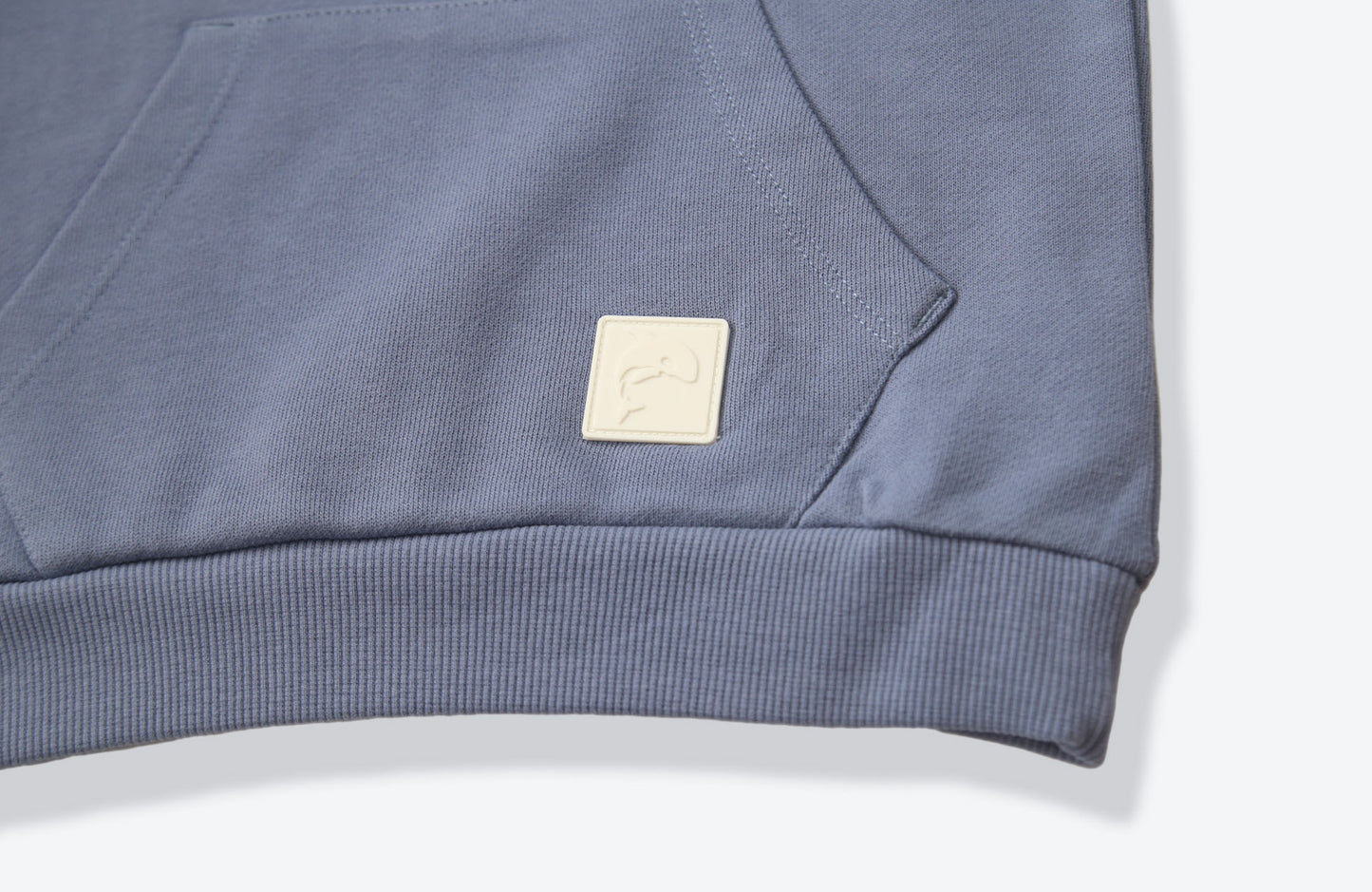 Kangaroo pocket and rib cuff detail on flint french terry kids hoodie