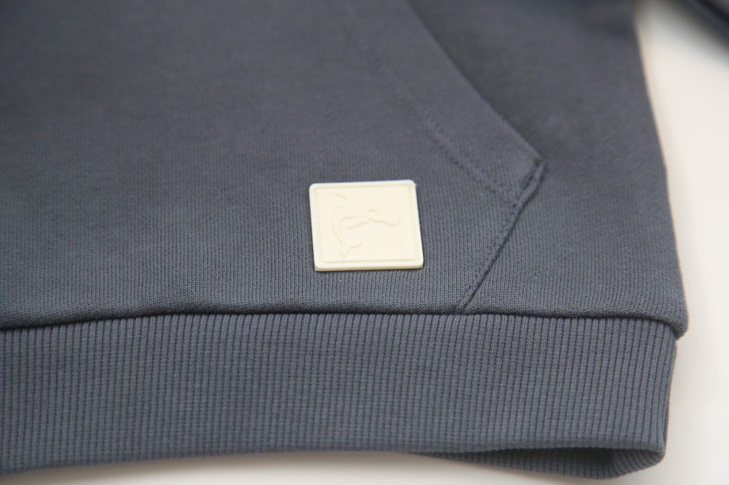 Kangaroo pocket and rib cuff detail on fjord french terry kids hoodie