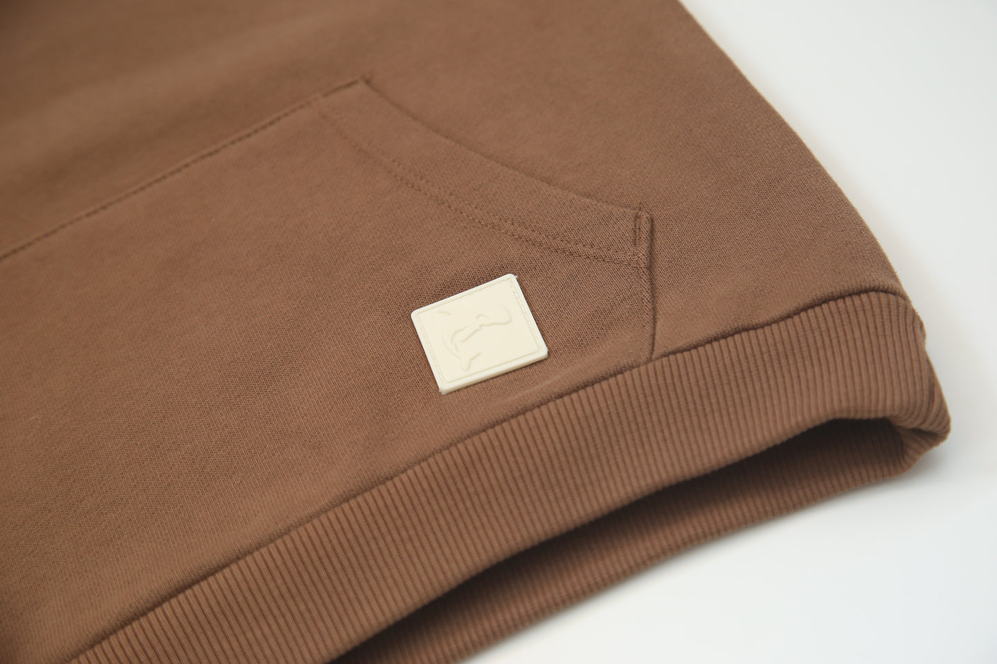 Kangaroo pocket and rib cuff detail on fjord french terry kids hoodie