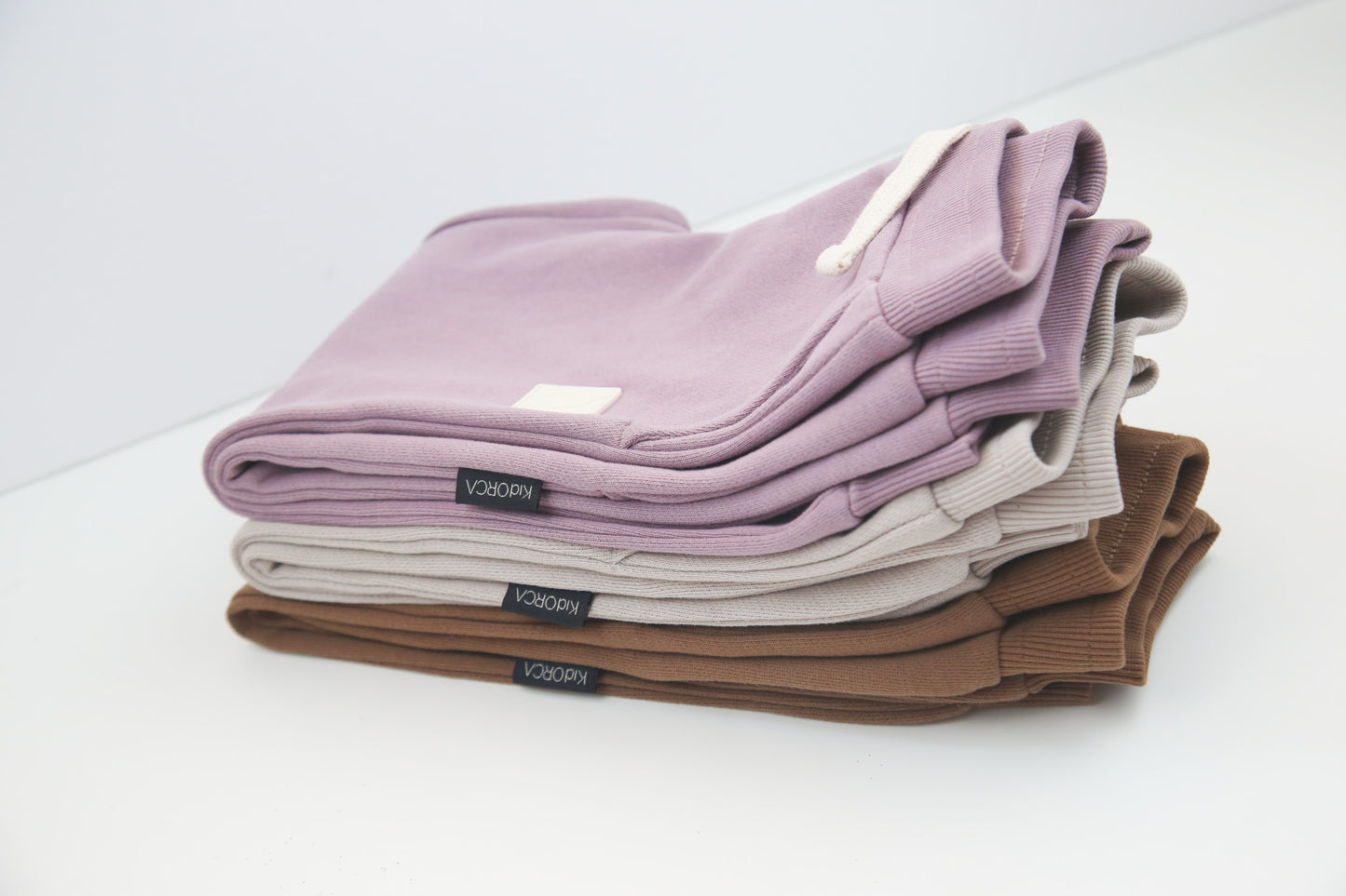 Rib cuff and side pocket detail on mocha kids sweatpants – organic brushed terry