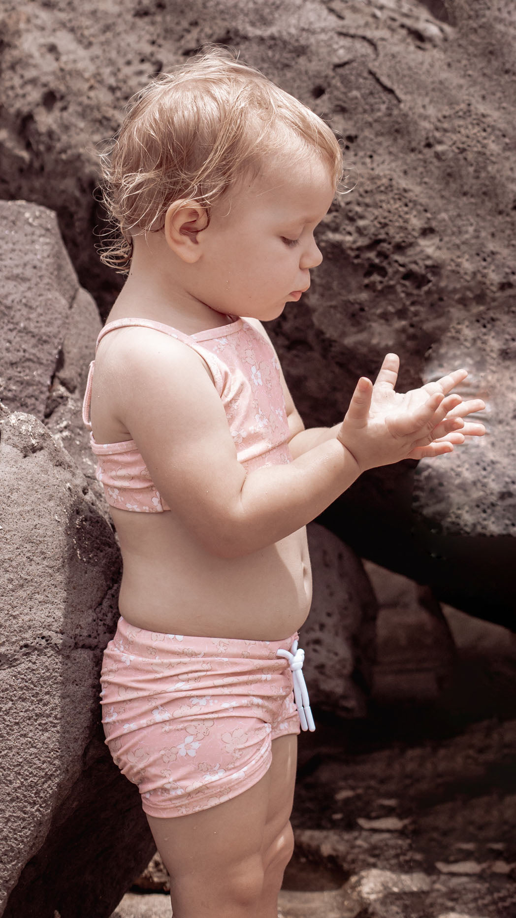 Girl playing in Evangelina Tuscany swim top by KidORCA