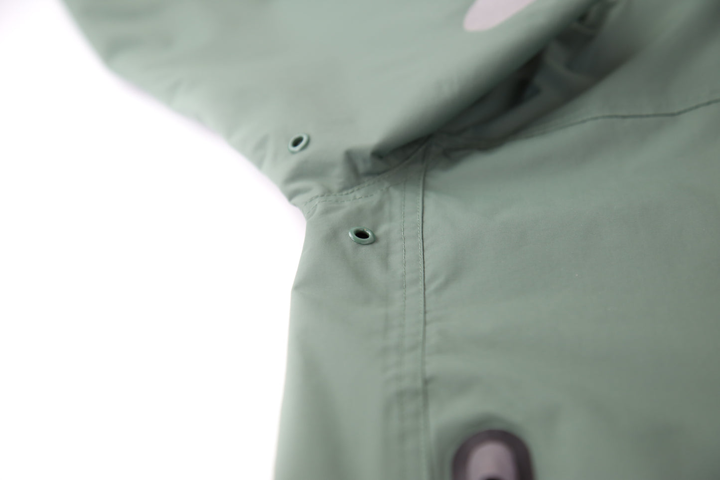 Taped seams and adjustable hood detail – olive hard-shell rain jacket