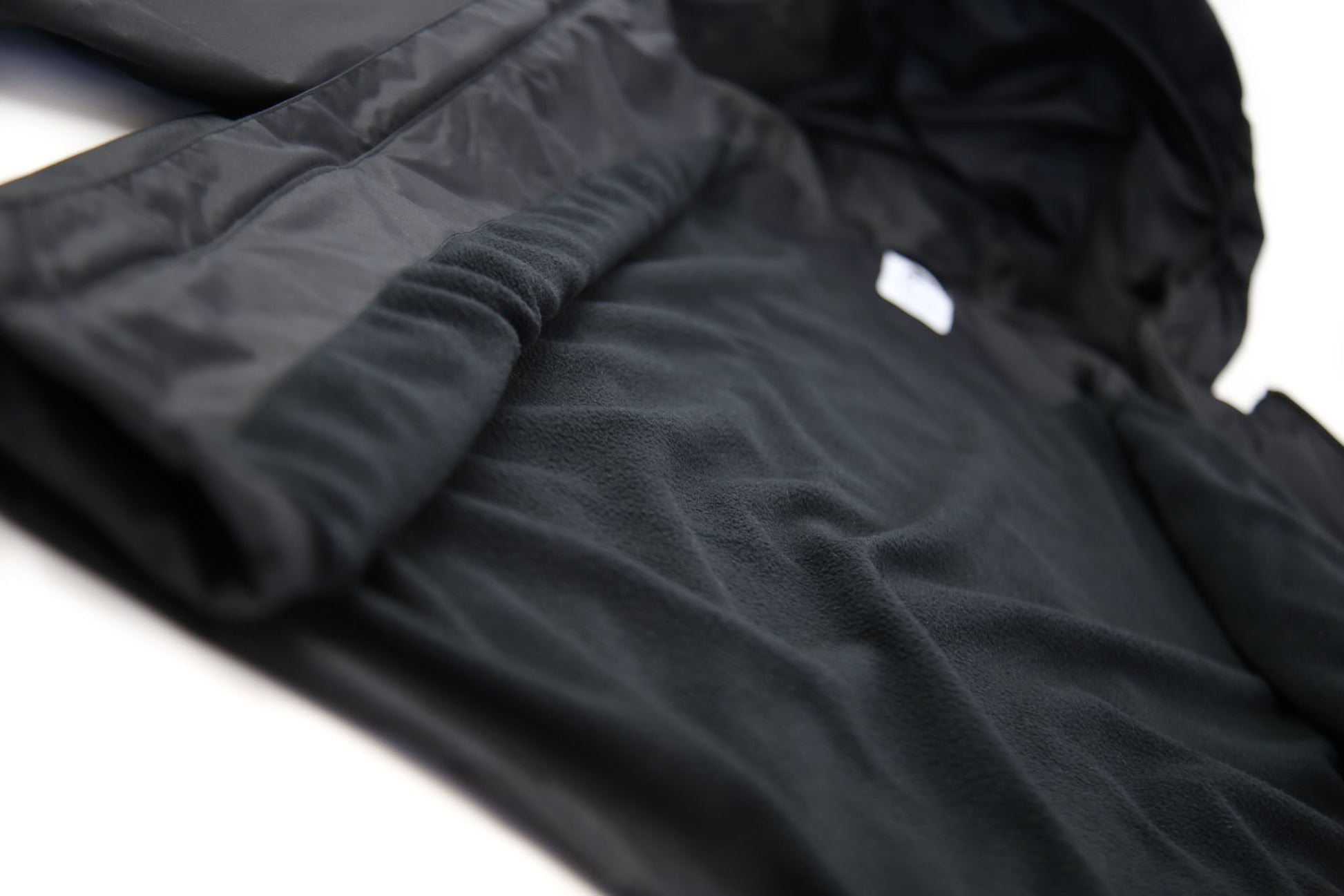 Close-up of insulated lining – black waterproof rain jacket