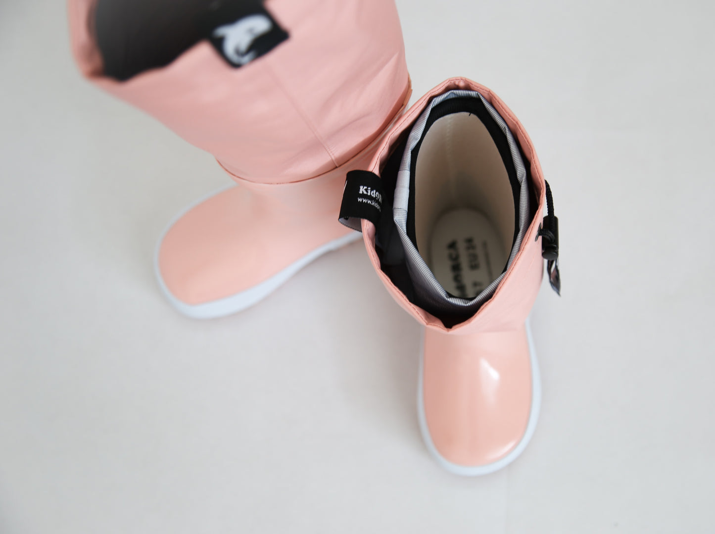 Close-up of rubber material and non-slip sole – coral rain boots waders