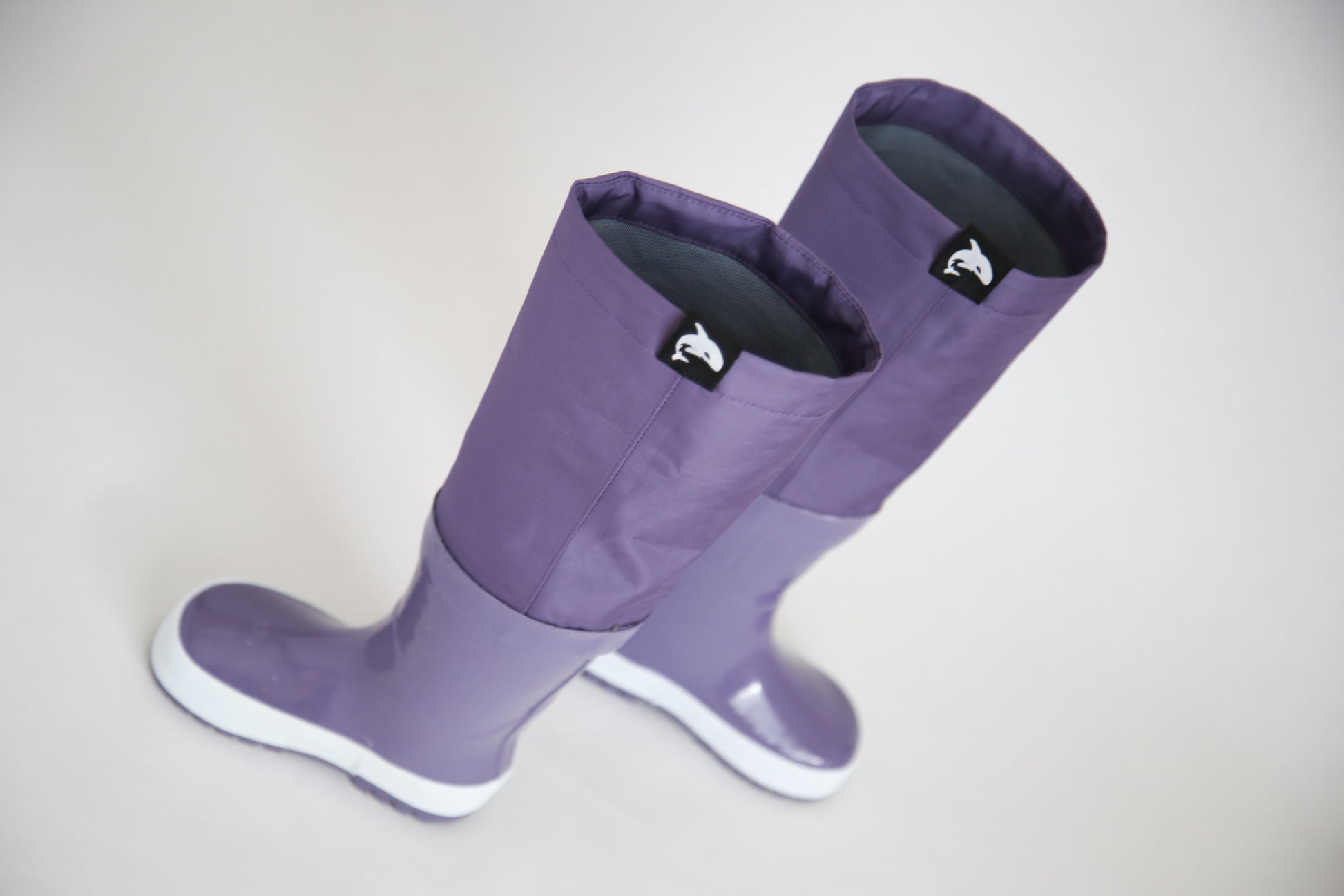 Close-up of waterproof rubber and non-slip sole – grape rain boots waders