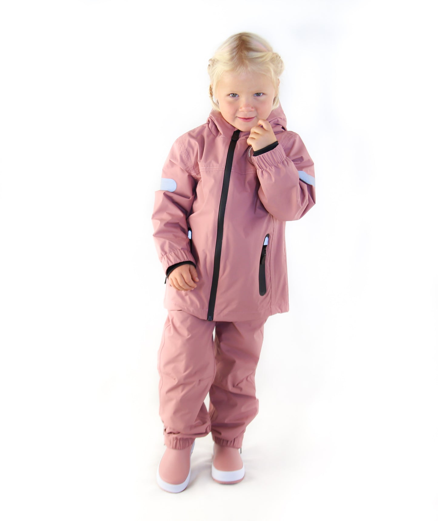 Child wearing ash‑rose hard-shell rain jacket – side view