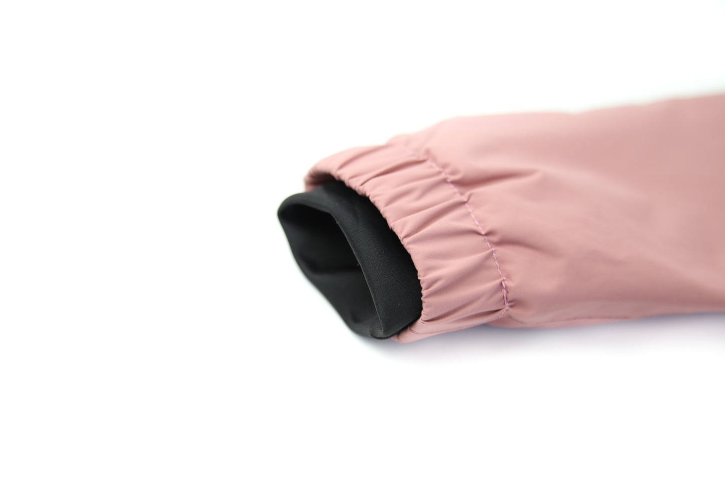 Close-up of waterproof zipper – ash‑rose rain jacket