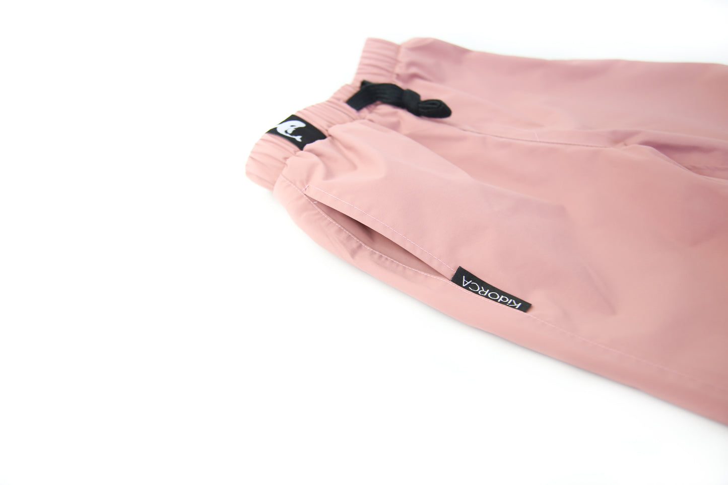 Close-up of waterproof breathable fabric – ash-rose rain pants