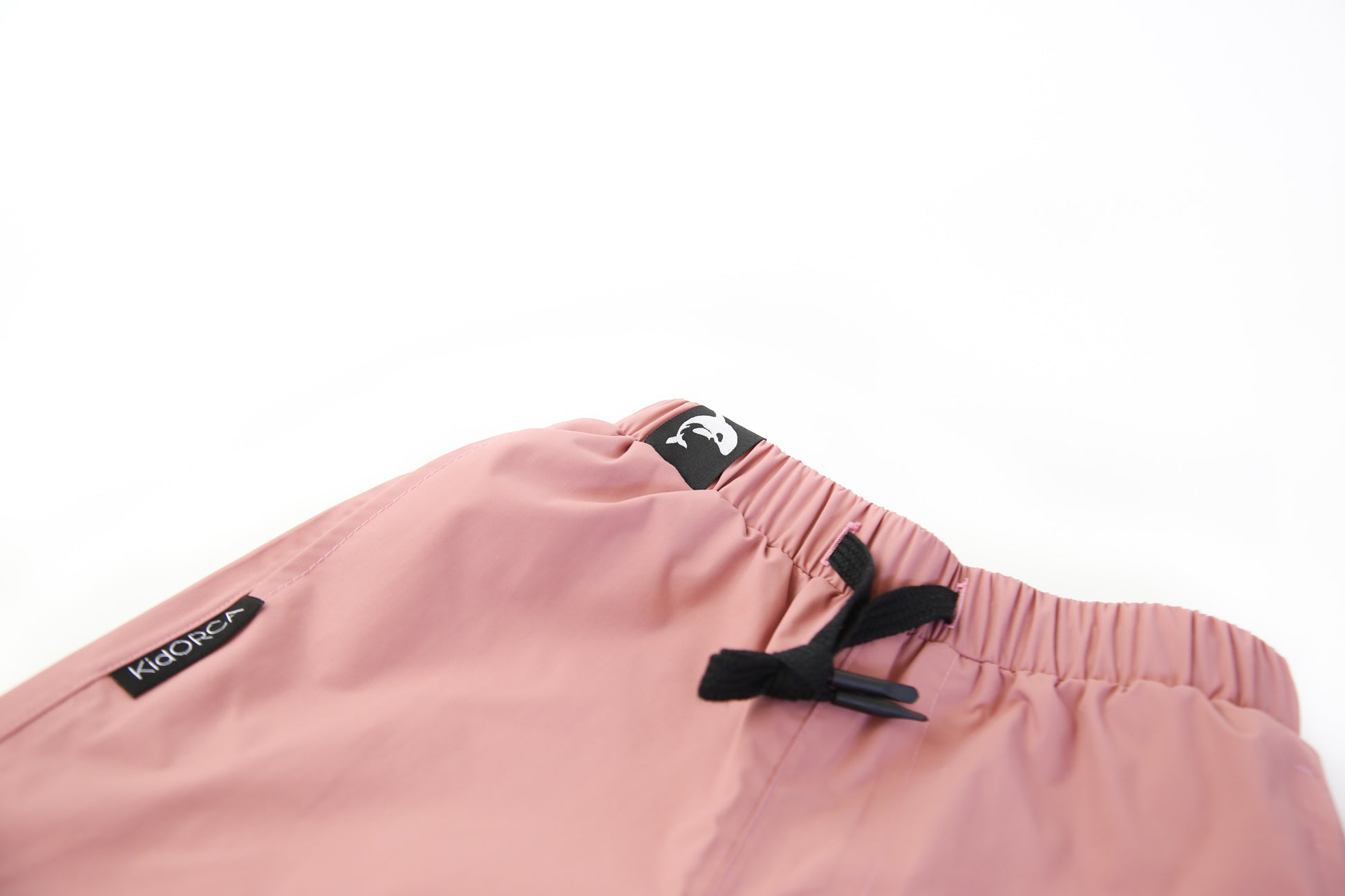 Elastic waistband detail – ash-rose hard-shell rain pants