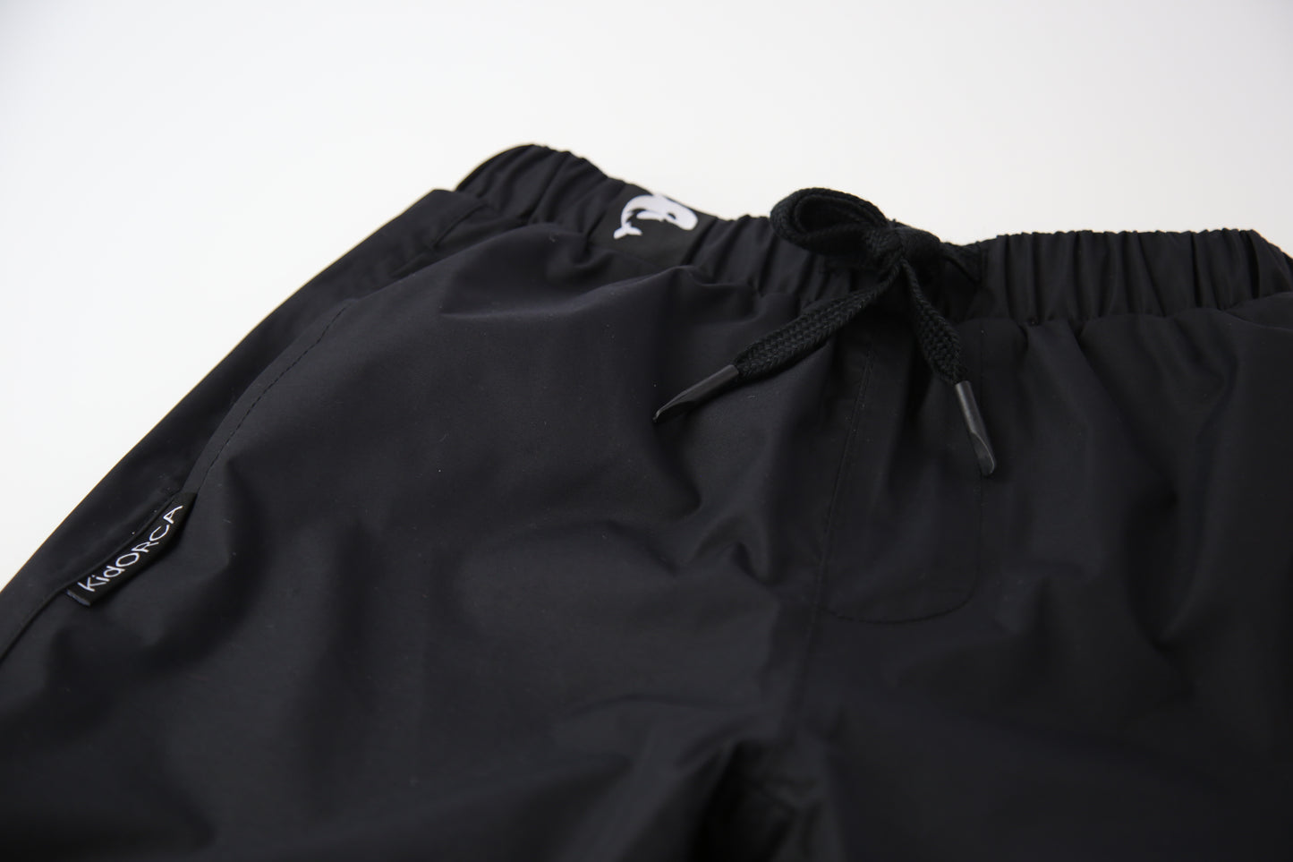 Kids black insulated waterproof rain pants – front view
