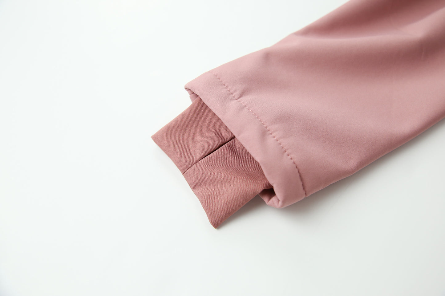 Close-up of waterproof breathable softshell fabric – ash-rose overall