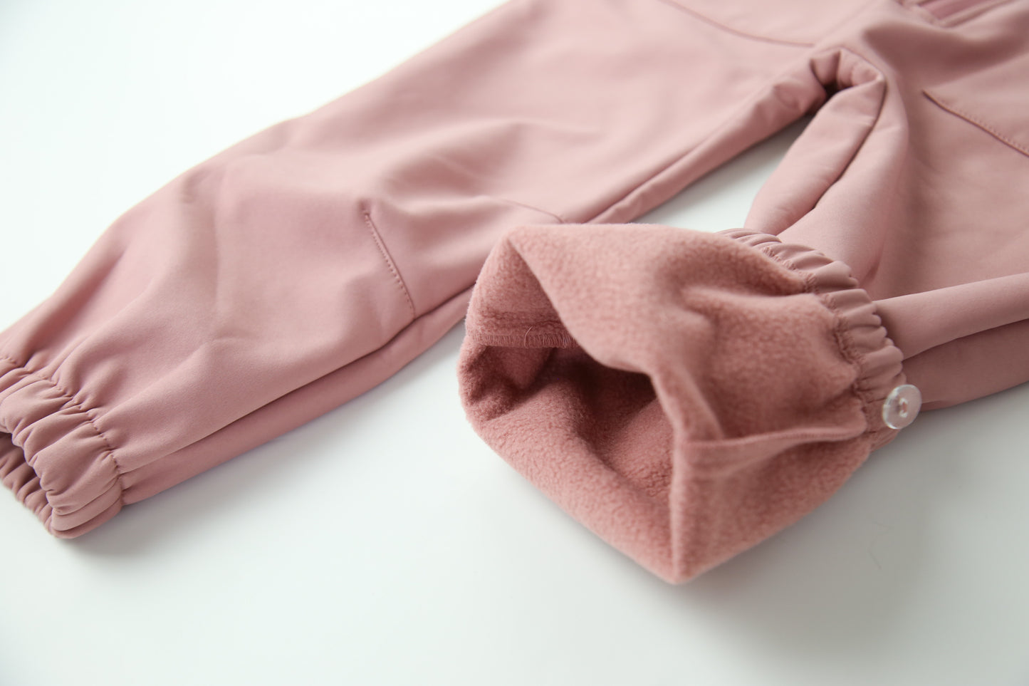 Wrist cuffs and ankle hem detail – ash-rose softshell play suit