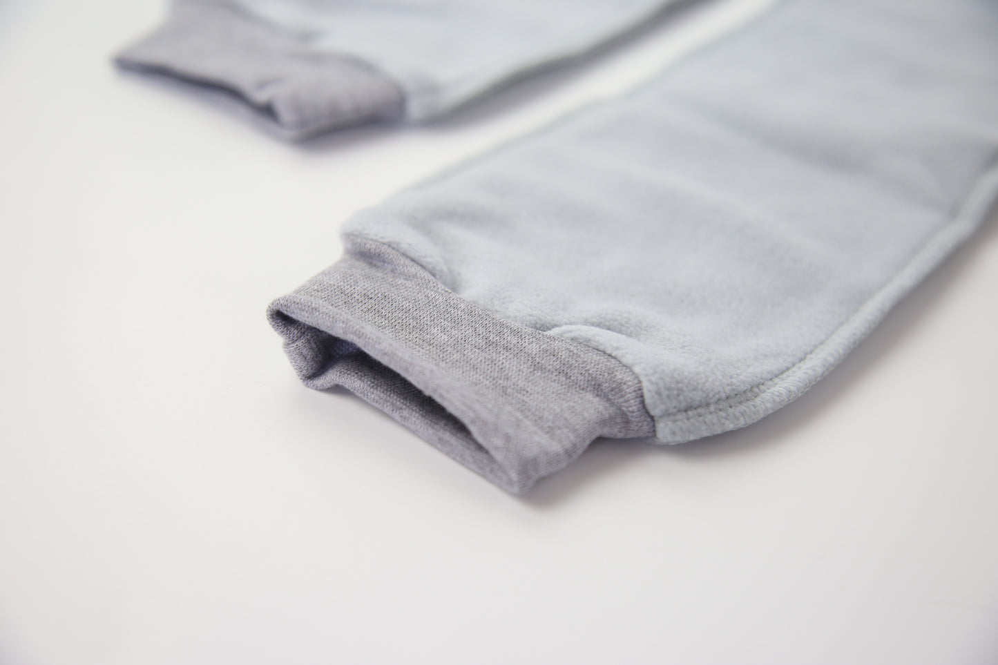 Close-up of grey fleece sock fabric texture – plush and warm