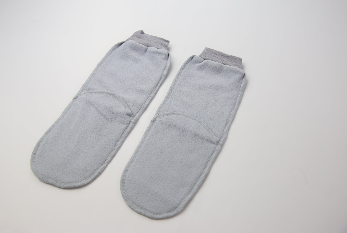 Close-up of grey fleece sock fabric texture – plush and warm