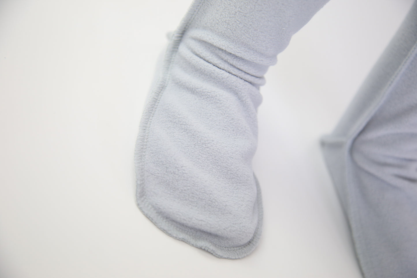 Close-up of grey fleece sock fabric texture – plush and warm