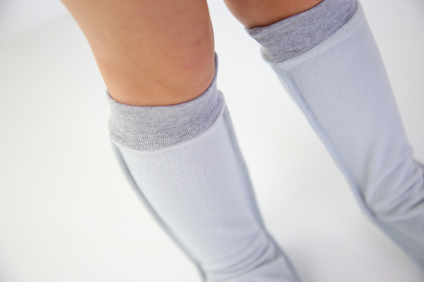 Close-up of grey fleece sock fabric texture – plush and warm