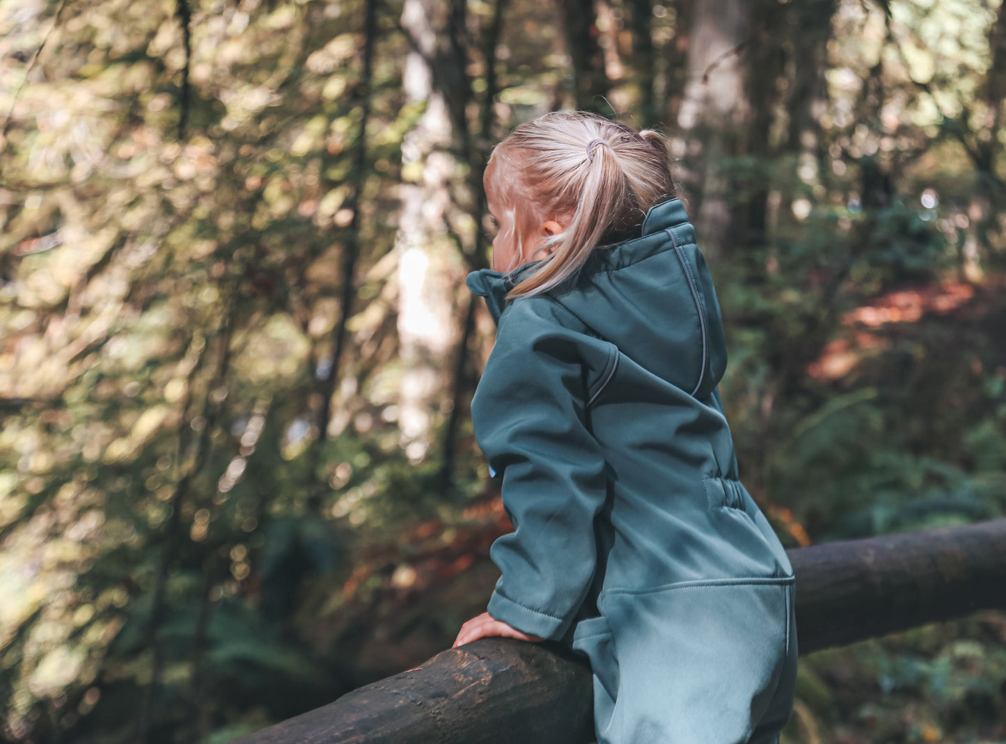 Child wearing olive play suit by KidORCA
