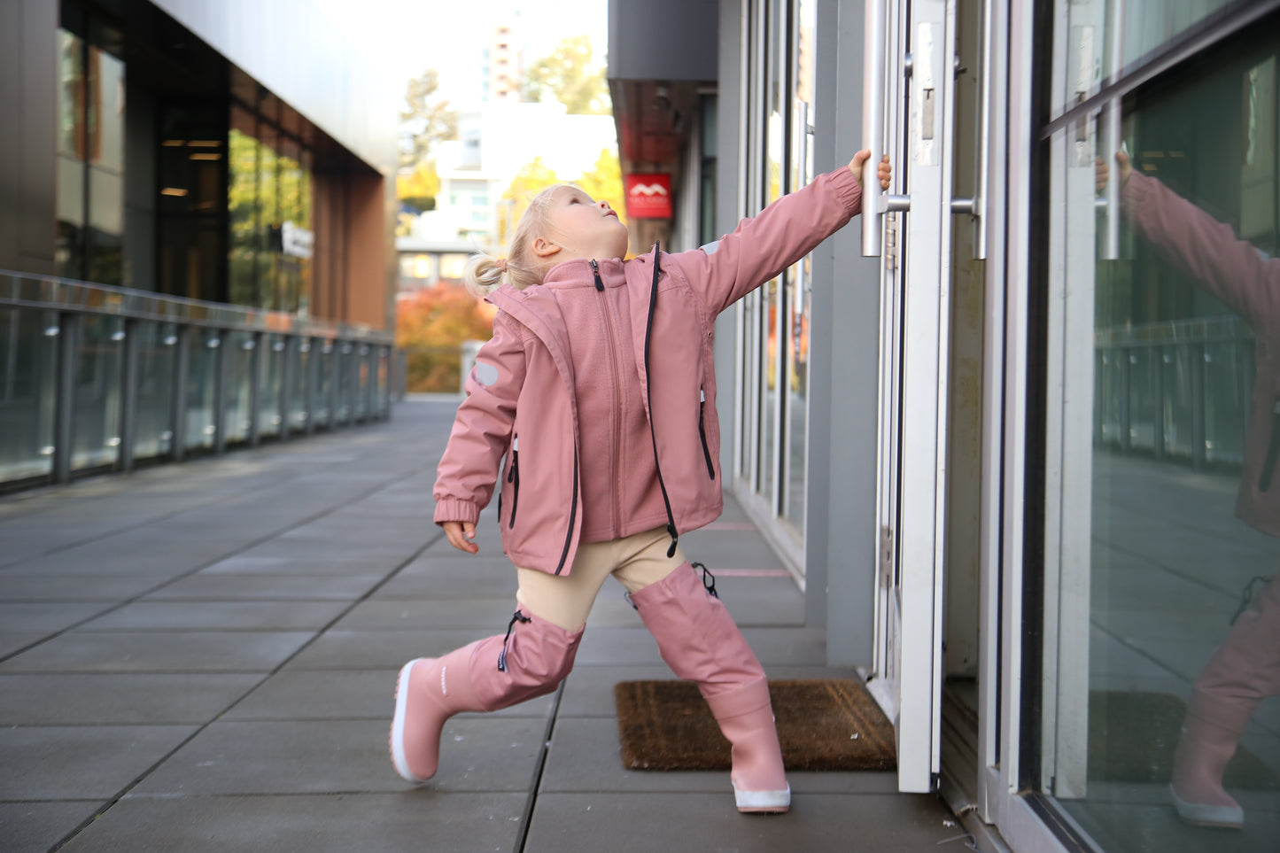Child wearing ash-rose fleece jacket by KidORCA